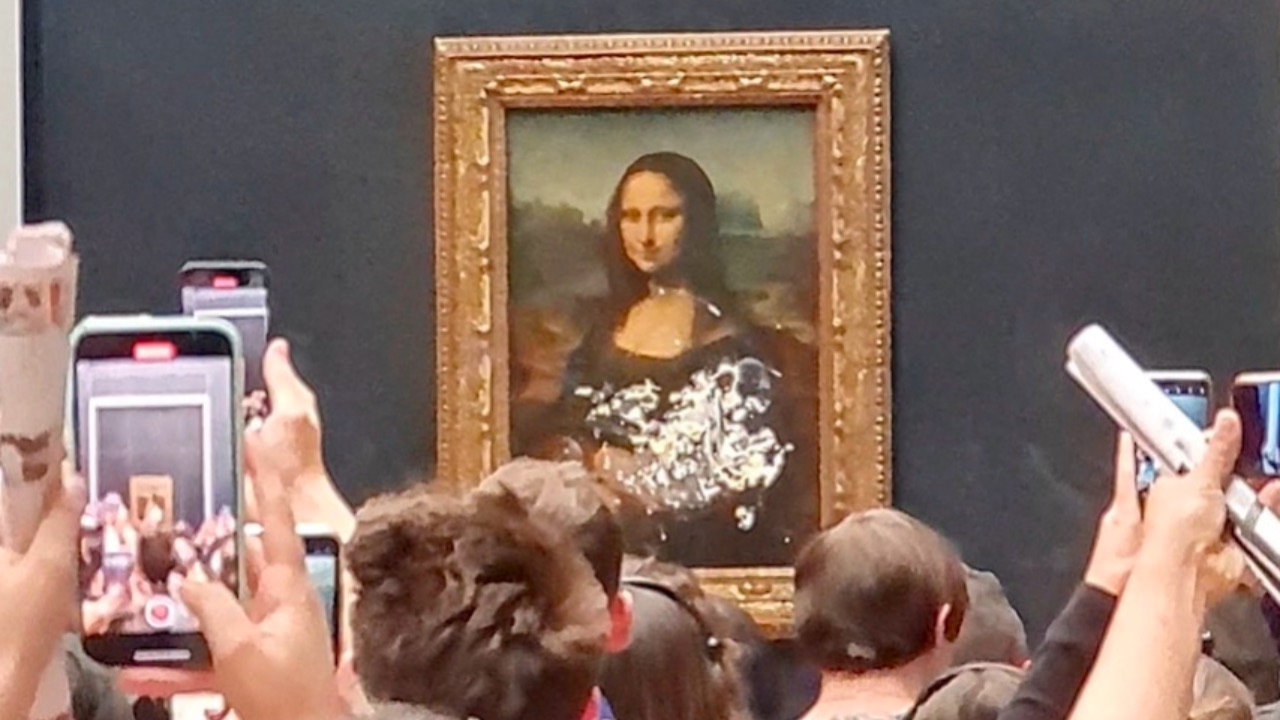 Mona Lisa gets caked in climate activist stunt