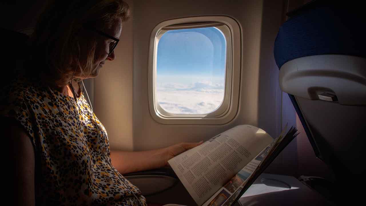 Air travel spreads infections globally, but health advice from inflight magazines can limit that