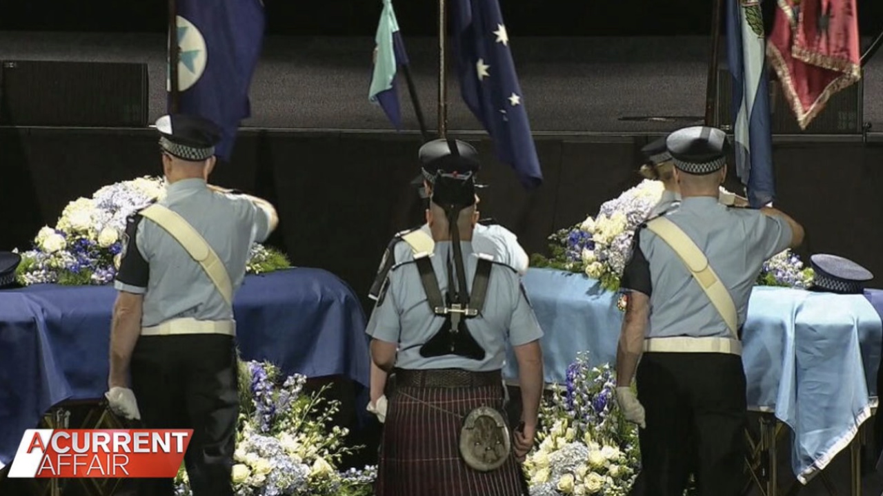 Slain police officers farewelled in emotional memorial service