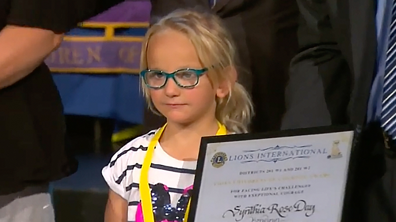 “A special girl”: Orphaned crash victim receives bravery award for saving baby brothers