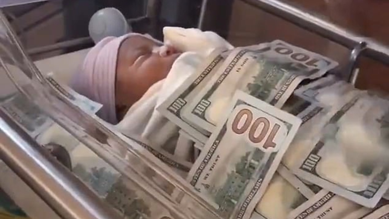 Million dollar baby! Video of newborn covered in money sparks outrage