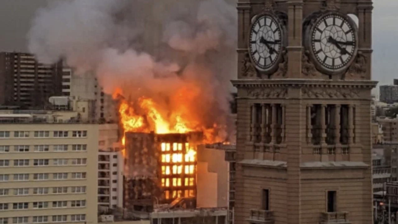 Wild moment captured as burning Sydney building collapses
