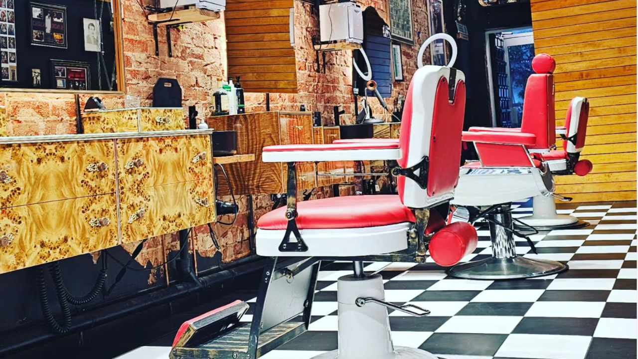 "The last male sanctuary": Barber shop campaigns to formally ban women