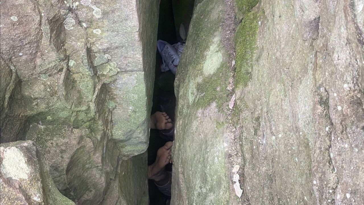 Woman rescued after getting stuck in between two boulders