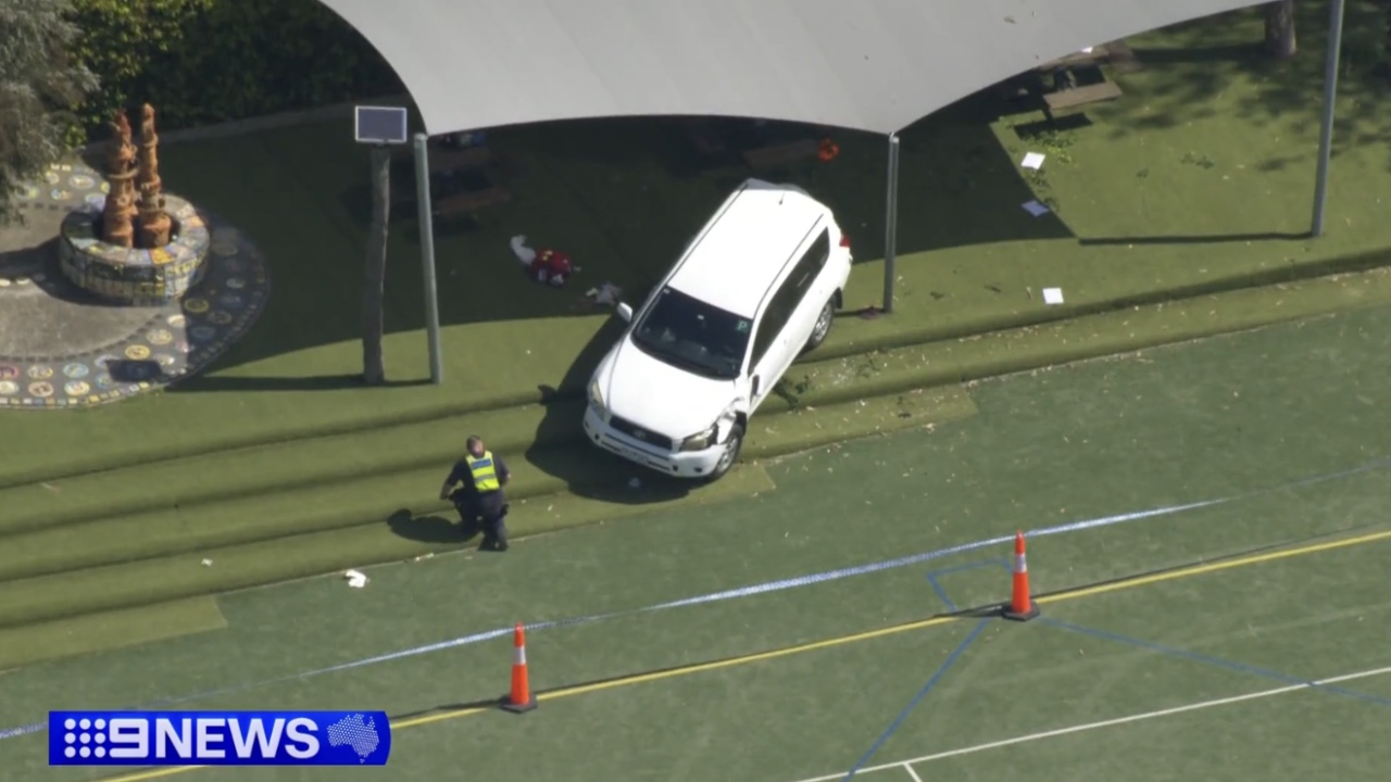 Child dies after car crashes through school gate