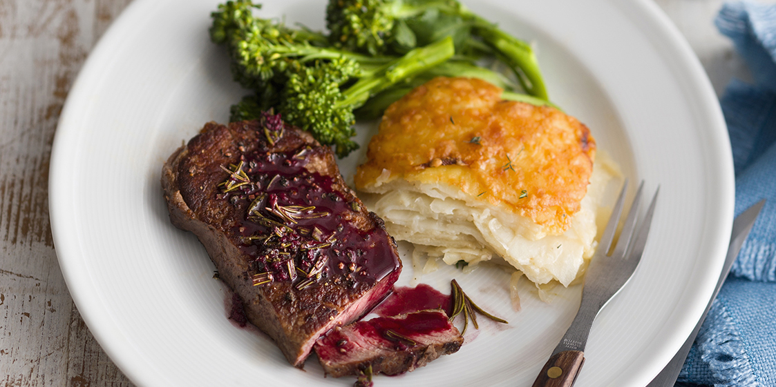 Peppered steak with red wine jus and potato bake OverSixty