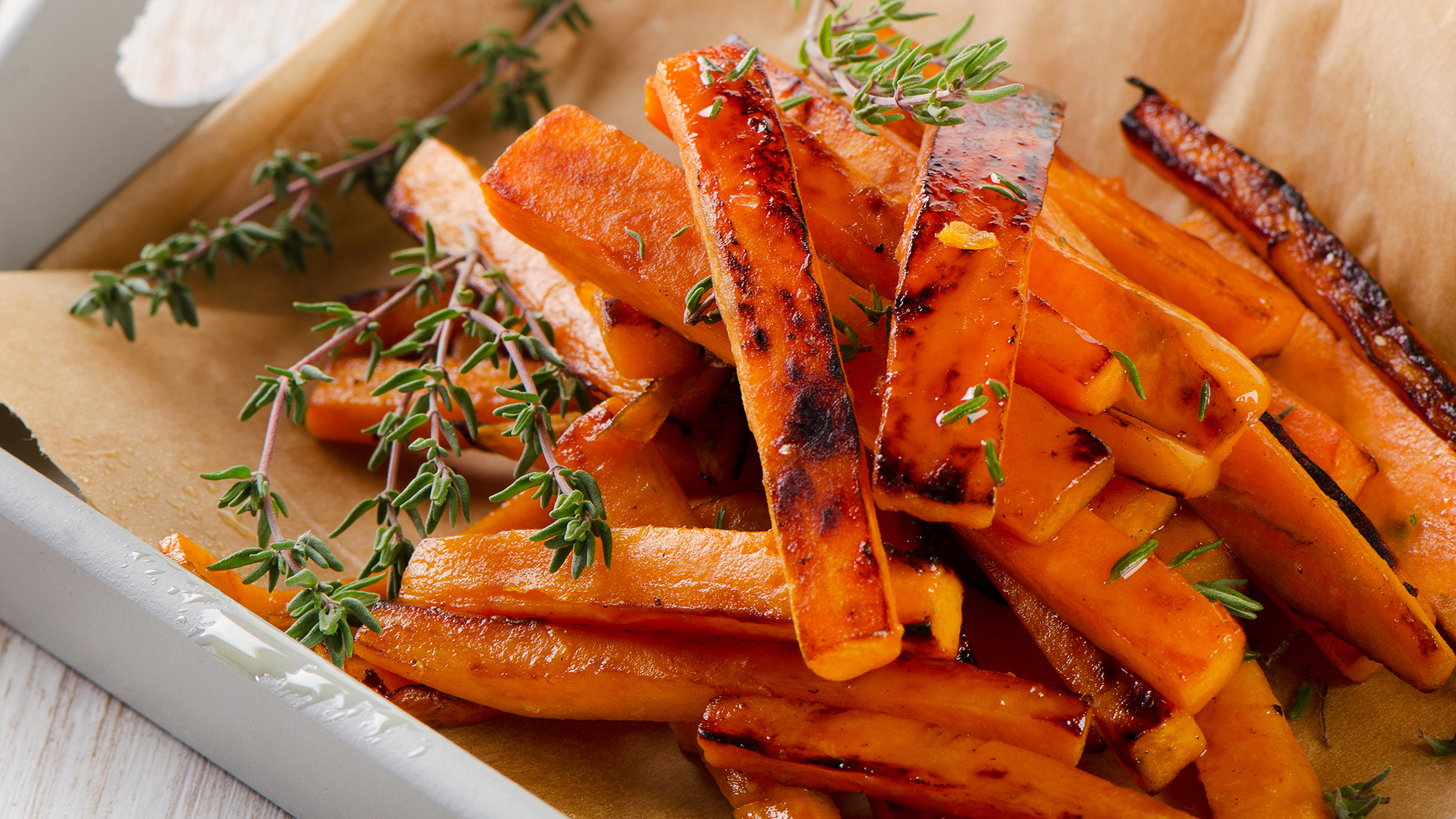 Maple glazed and thyme baked sweet potato chips | OverSixty