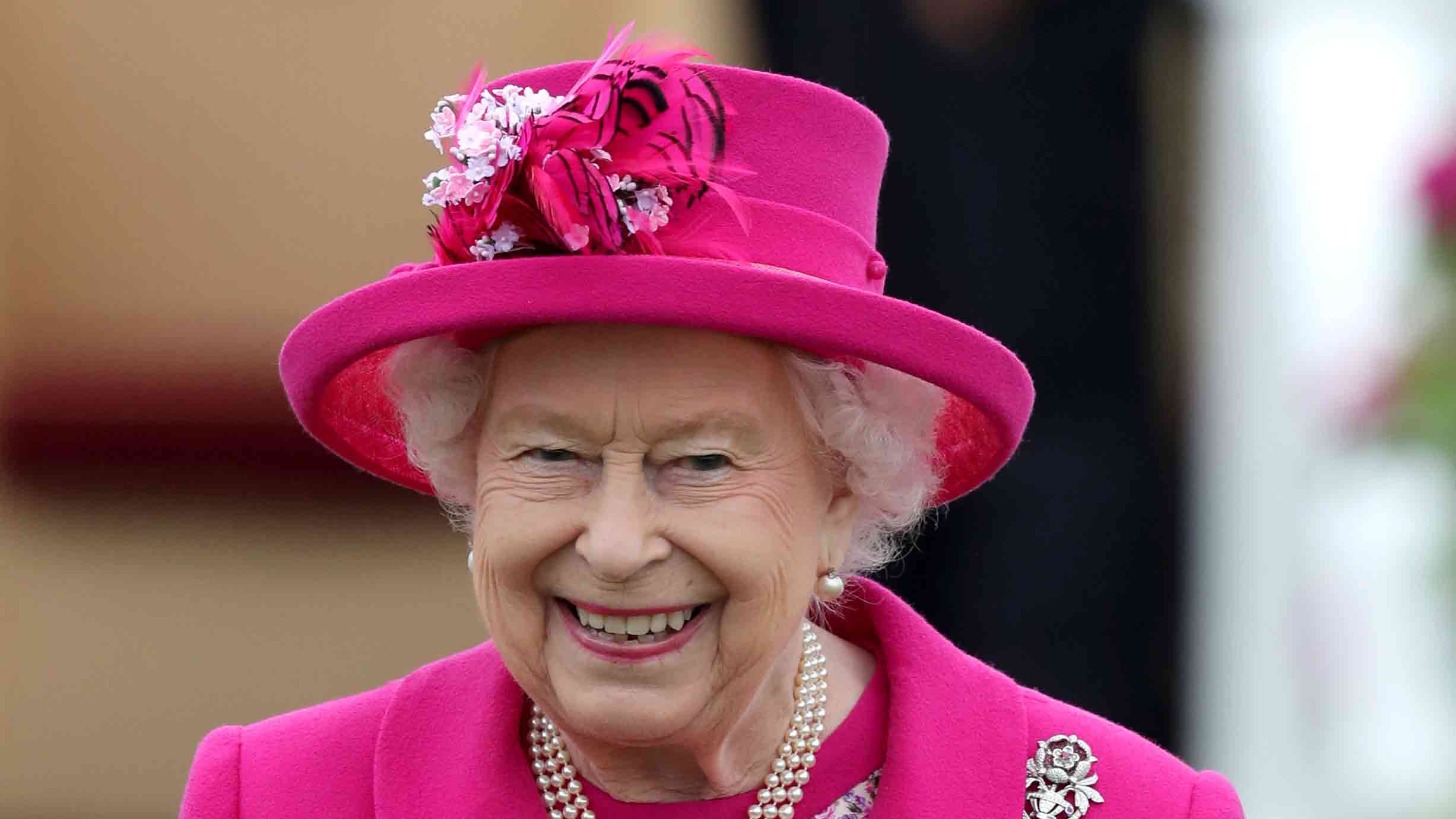  Impeccable style: Queen radiant in bold fuchsia for 6th engagement in one week 