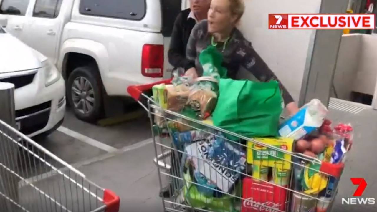 Woolies staff chase woman allegedly stealing trolley full of groceries
