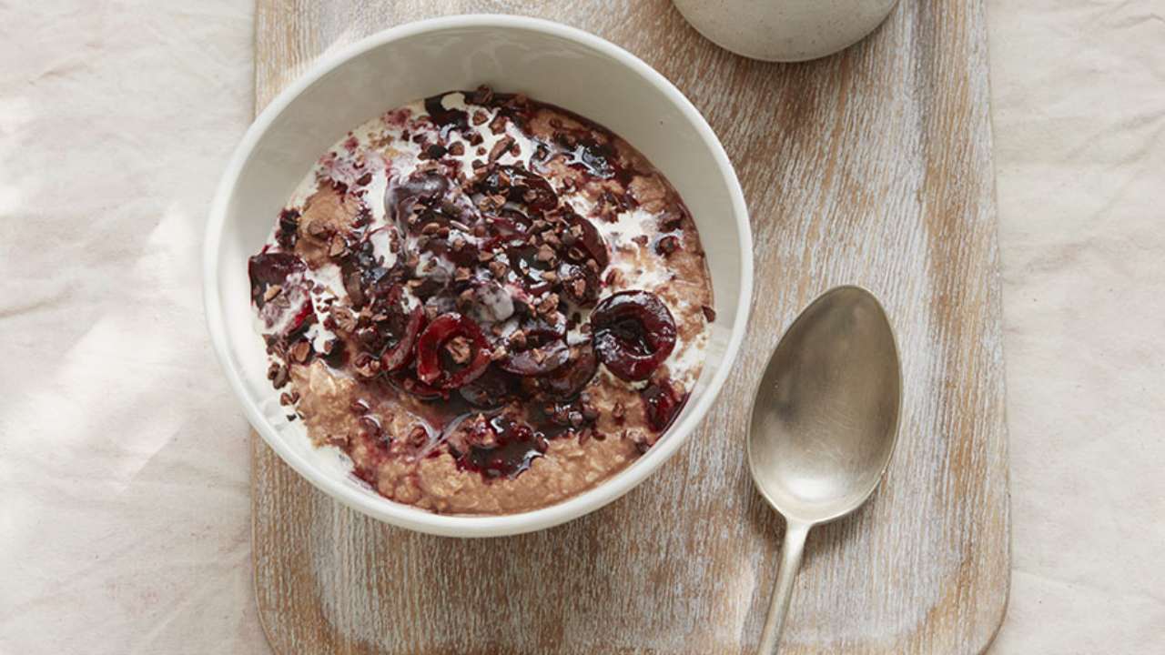 Indulge yourself with chocolate coconut porridge and poached cherries