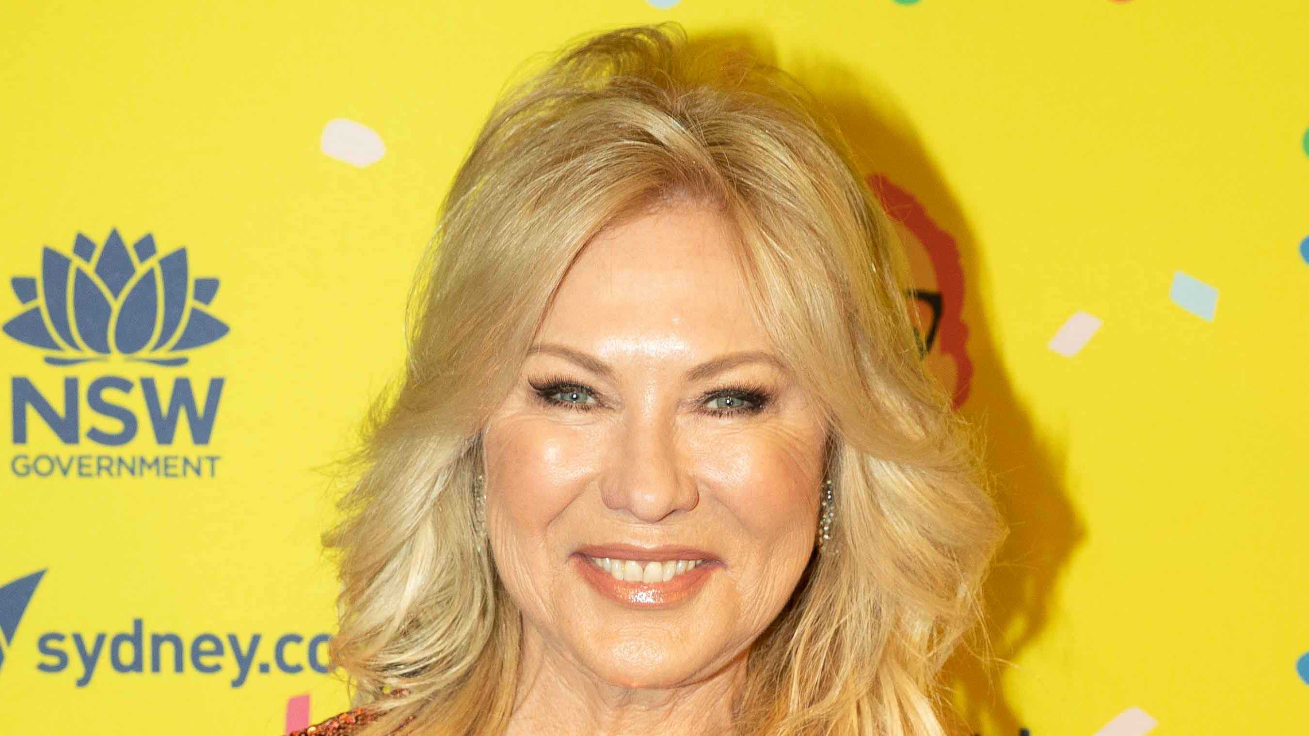 Glittering in gold! Kerri-Anne Kennerley sparkles on the red carpet 