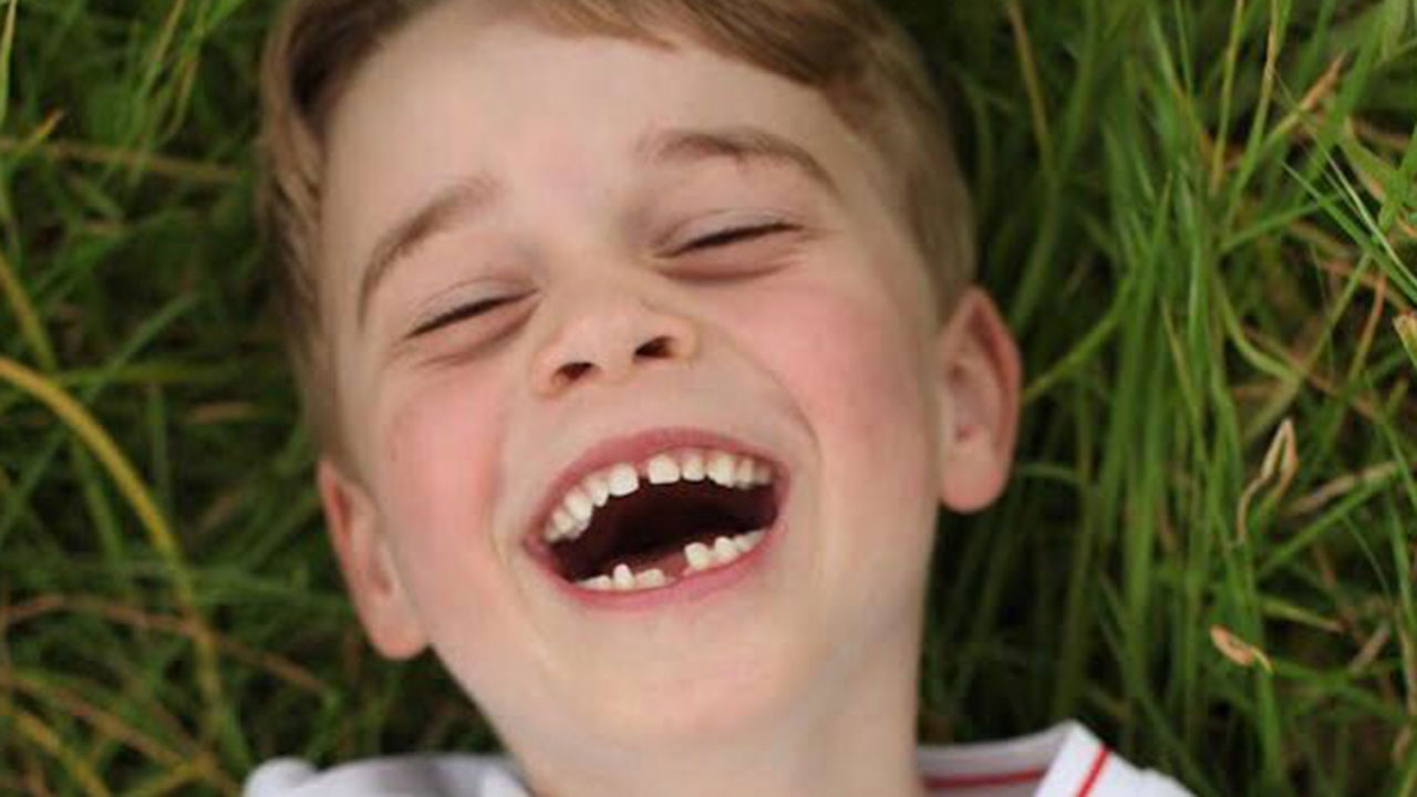 So cute! Prince George flashes toothy grin in new photos marking his 6th birthday