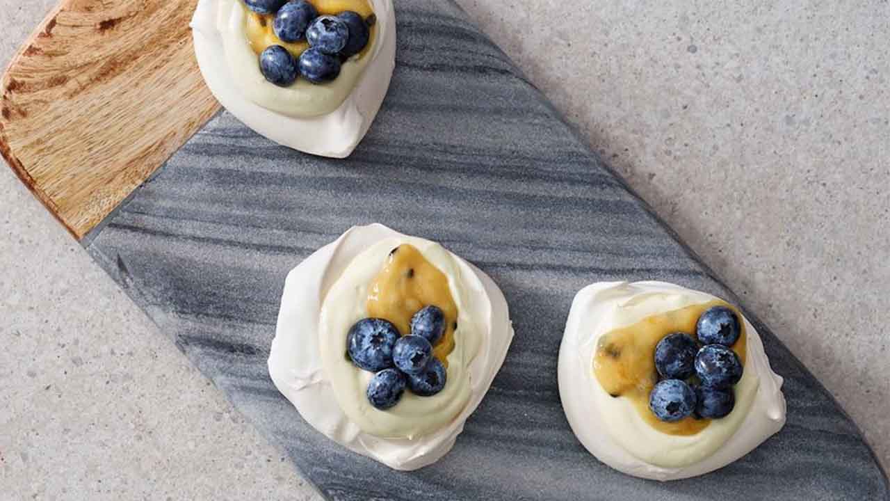 A sweet delight: Blueberry and passionfruit pavlovas