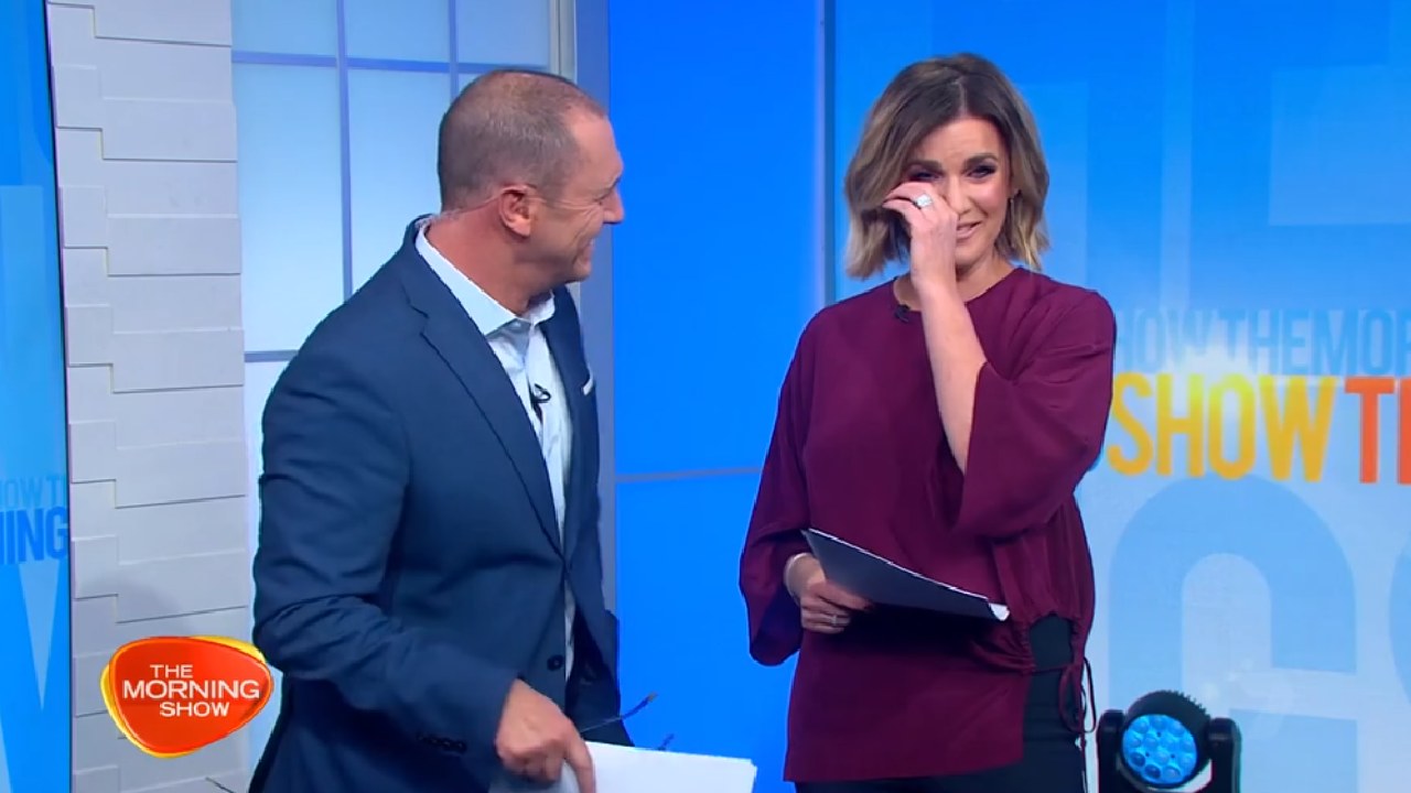 Keep it together: Larry Emdur and Kylie Gillies lose it over news story