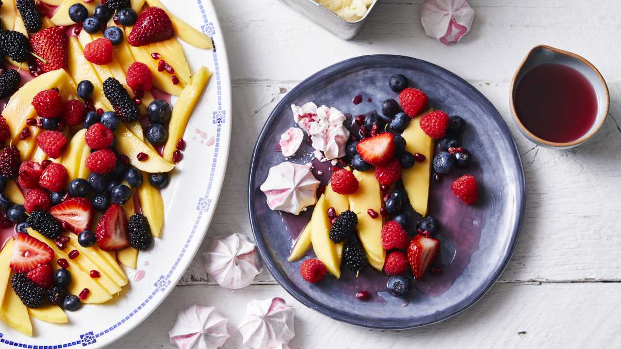 Mango and berry fruit salad with rosé syrup
