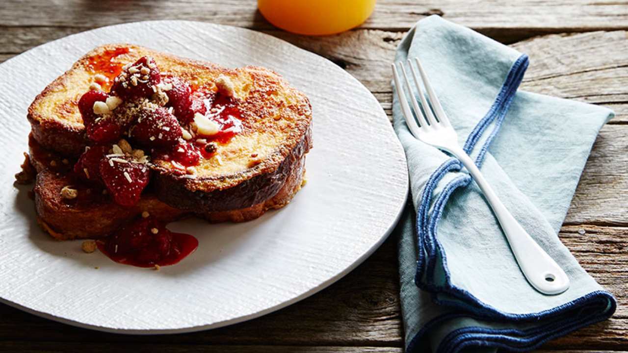 Relax with some French toast with balsamic strawberries and macadamia crumble