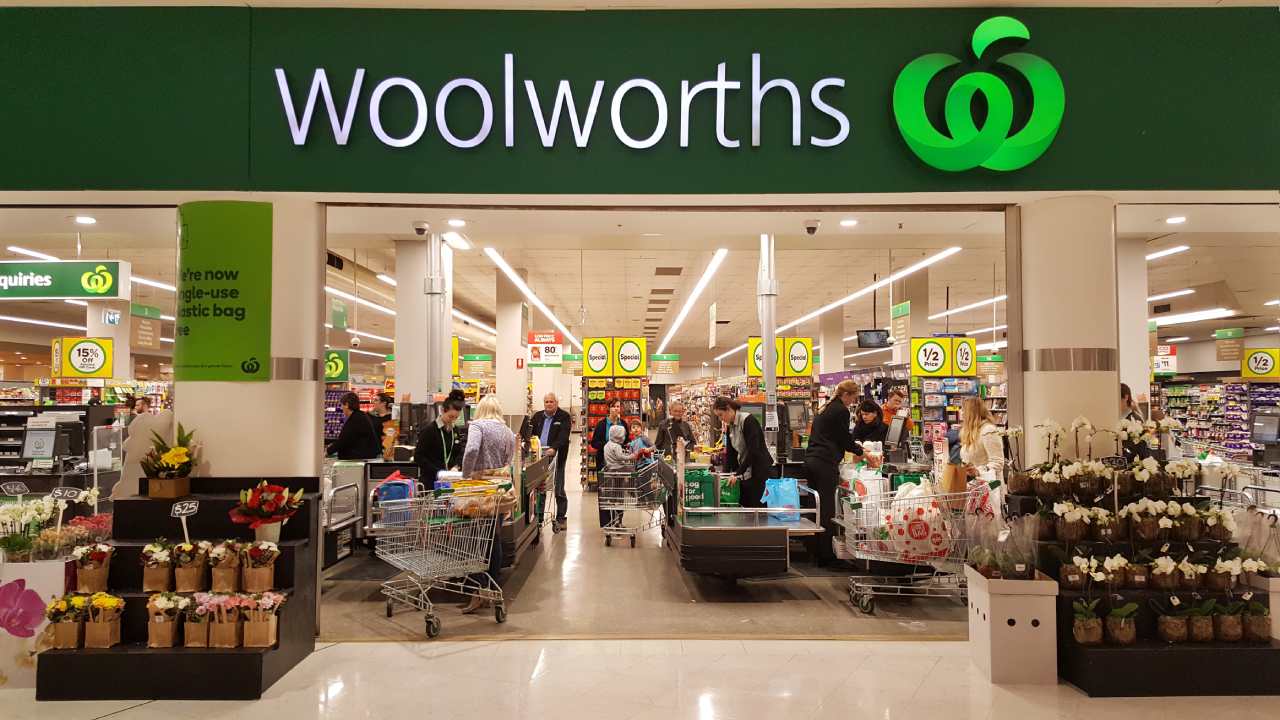 Shoppers throw punches in packed Woolworths in front of shocked onlookers