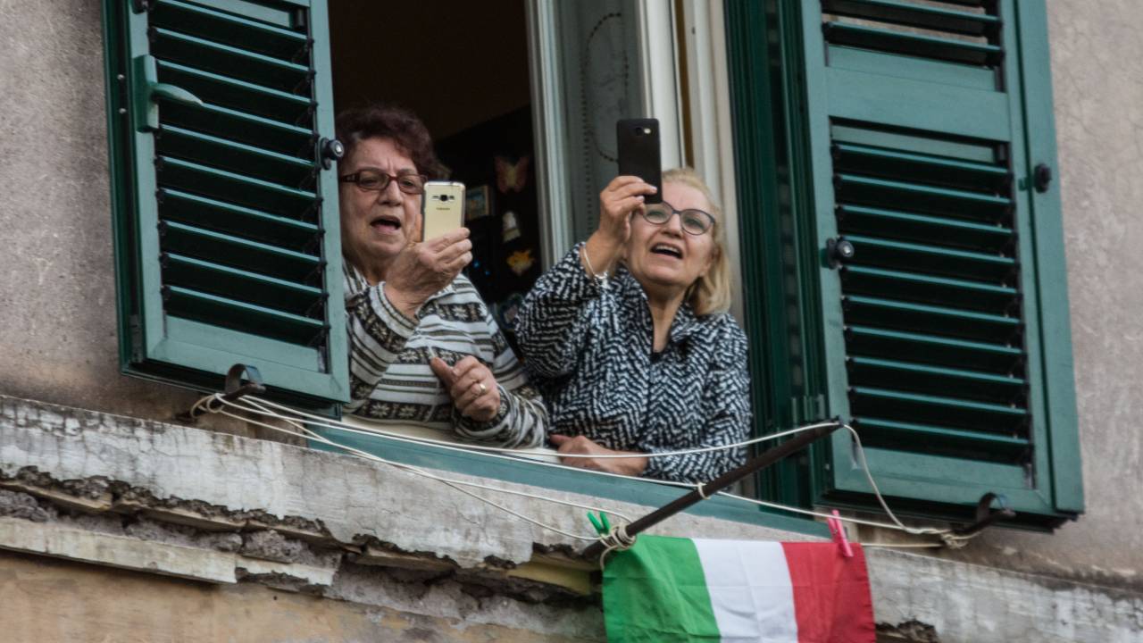 Free impromptu concerts break out from Italian rooftops and balconies