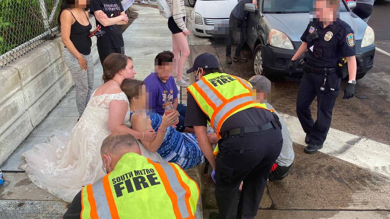 "Rockstar bride" helps victims of car crash in wedding dress