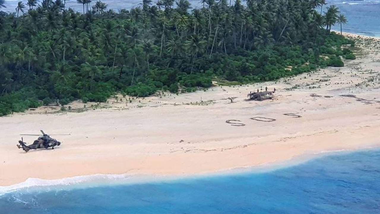 Sailors rescued from tiny island after writing giant "SOS" in the sand