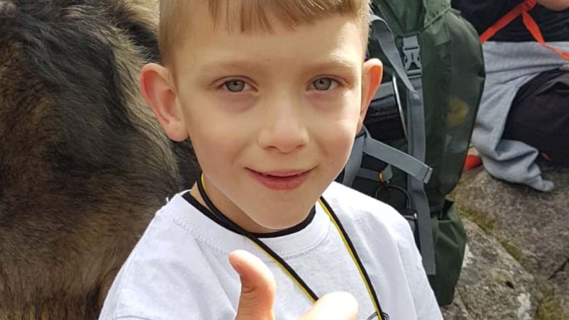 Boy climbs UK's tallest mountain after being told he’d never walking again