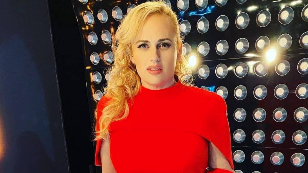 Lady in red: Rebel Wilson stuns in a Meghan Markle classic