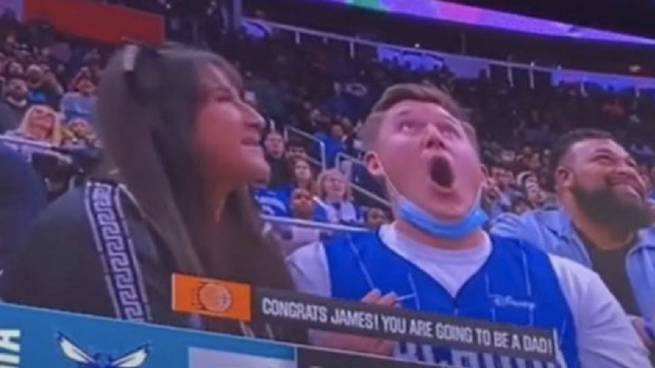 Crowd goes nuts as man learns he's a dad on the big screen