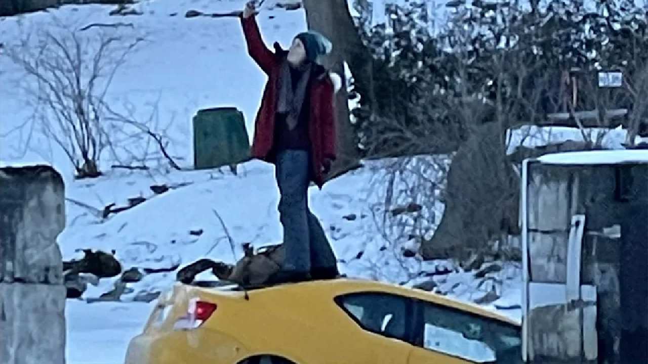 "Poise under pressure": Woman snaps selfie as car sinks in ice